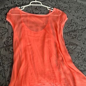 Light and airy sheer top over camisole in Coral. Size L